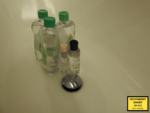 bottles of baby oil in a sink