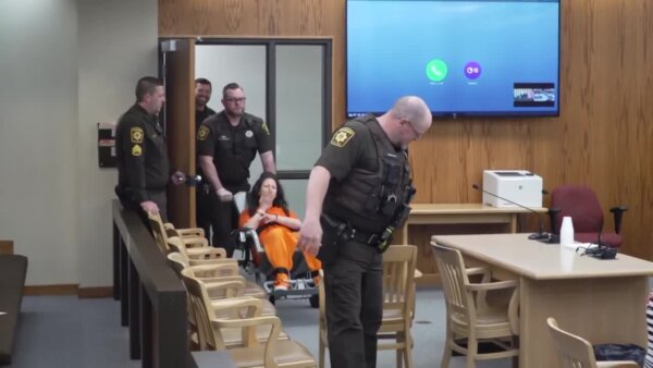 Shackled Taylor Schabusiness blows a kiss at hearing in battery case
