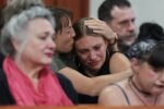 Dylan Mortensen gets a hug after speaking at the sentencing hearing of Bryan Kohberger