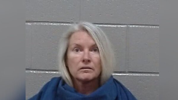 Woman charged with murder after missing husband’s body found in carport