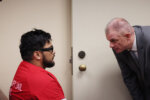 Jake Haro speaks to public defender Brian Cosgrove