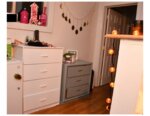 hallway with dressers