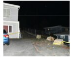 rocks, crime scene tape, house