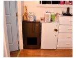 Two refrigerators with white claw boxes on them