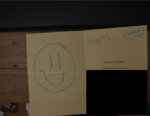 smiley face drawn on birthday card