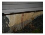 Red drips on exterior of house