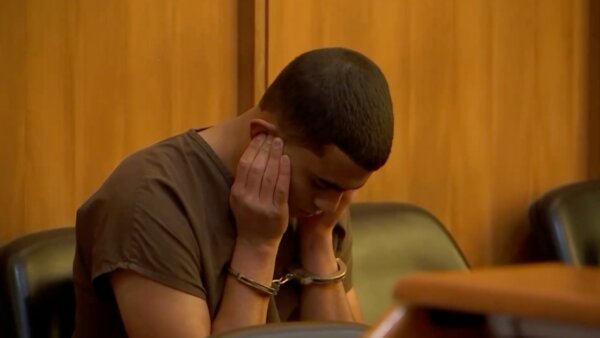 Teen accused of murdering mother holds ears as evidence plays in court