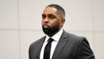 Sherrone Moore, center, appears in the courtroom