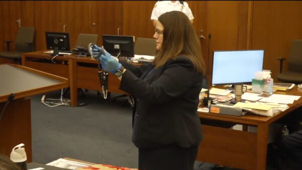 Jennifer Sprague holds exercise band