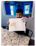 Dawson Clancy holds a drawing