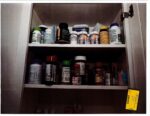 pill bottles in kitchen cabinet