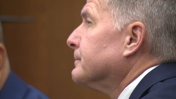 Gregory Moore sits in court