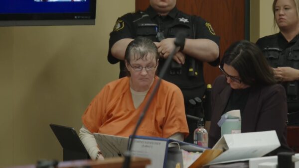 Cortney Bartholomew sits in court