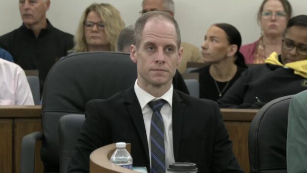 Caleb Flynn sits in court