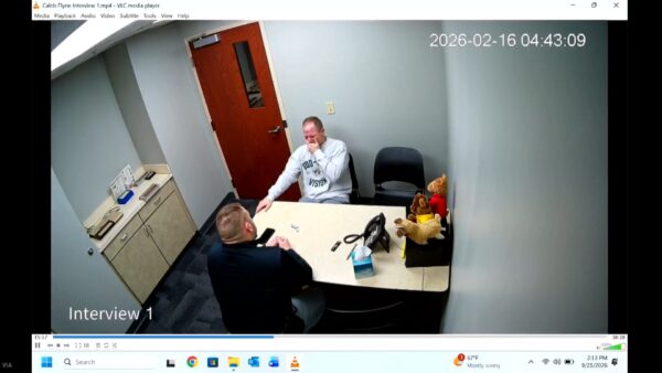 Caleb Flynn cries in a police interrogation