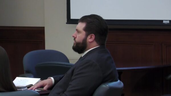 Matthew Konen sits in court