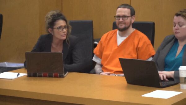 'You're a coward!': Killer smiles at sentencing as he's confronted by victims' families