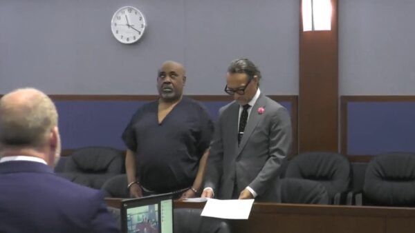 Duane Davis rolls his eyes in court