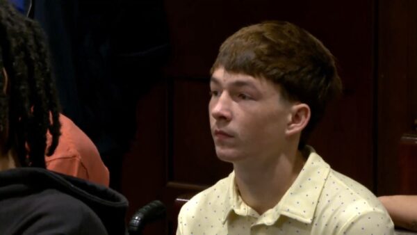 Jaden Auclaire sits in court