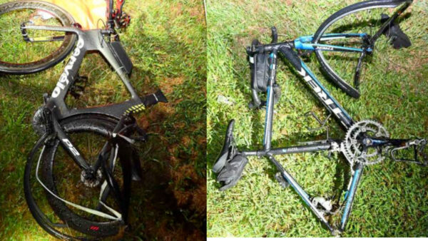 Two damaged bikes on grass